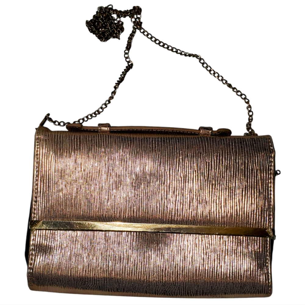 Rose gold crossbody clutch styled  purse w/ gold trim at snap closure